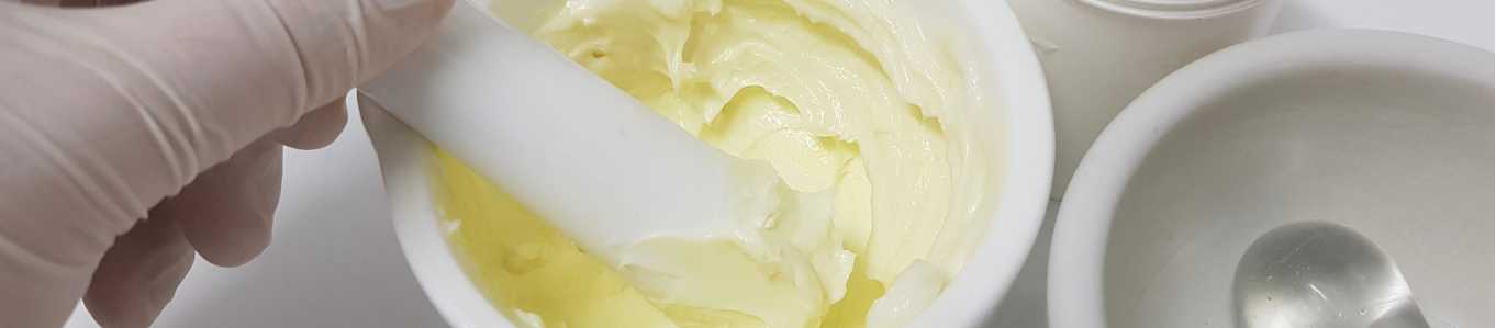 Pharmacist compounding a topical cream base - Makson Healthcare ointment manufacturing